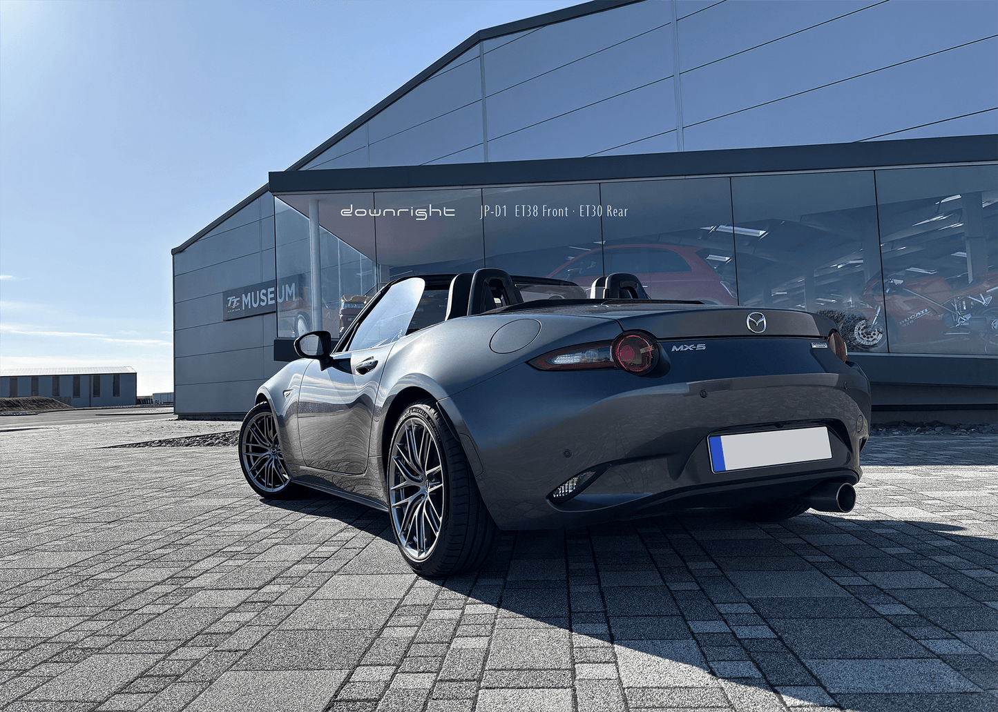 Gray Mazda MX-5 ND with shinny wheels from downright in diamond silver parked in front of Isle of Man Motor Museum