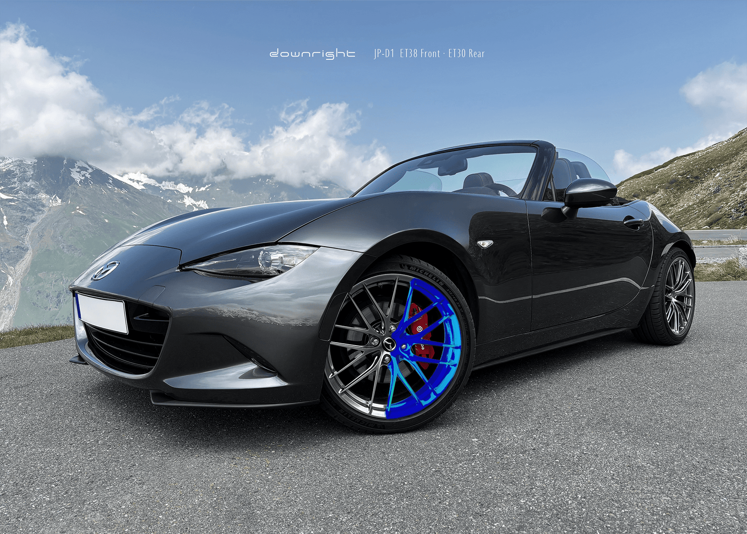 Grey Mazda MX-5 ND with shinny wheels from downright and red Brembo brake caliper parked on a mountain road of Grossglockner, half of the wheel is marked with color indicating perfect stress distribution by finite element analysis
